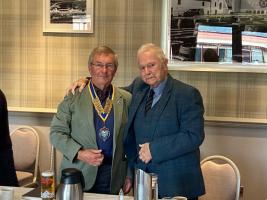 Outgoing President, Ronnie Dunn, hands over chain of office to Stewart McNeish.